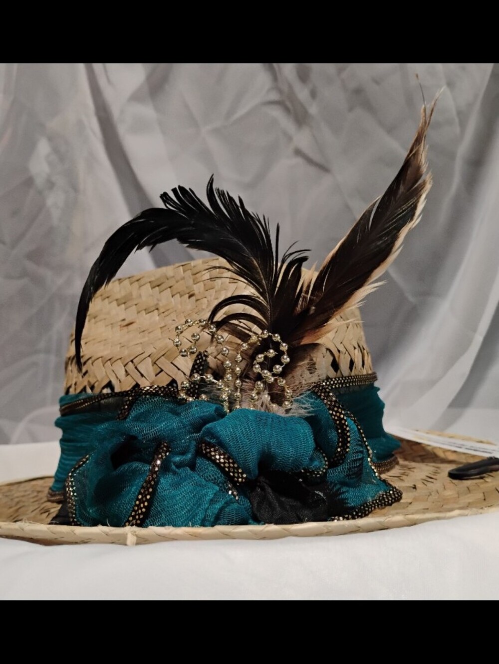 Handmade hat featuring feathers from our very own rooster, Mr. Kentucky!